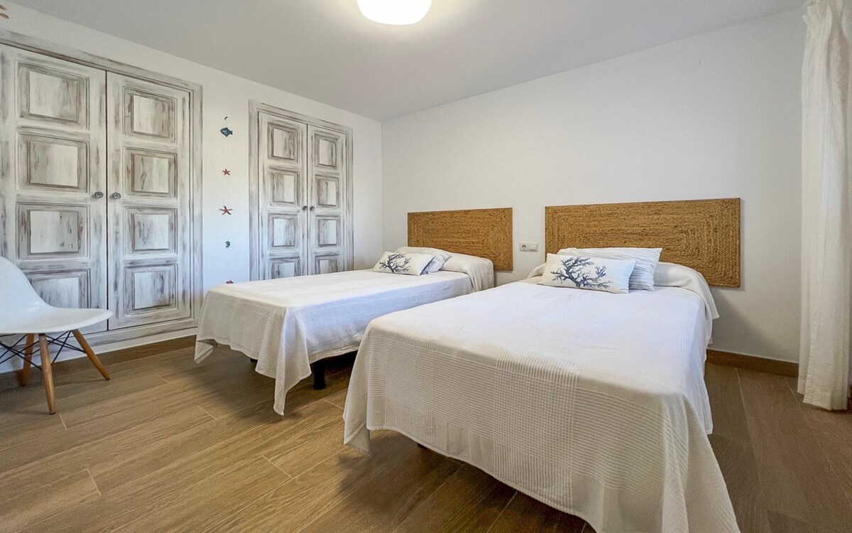 Main bedroom with queen bed and walk-in closet